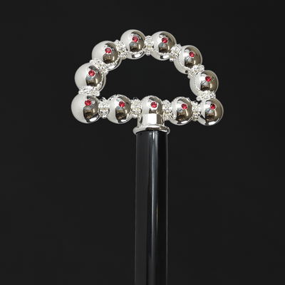 Bright walking stick with spheres and crystals