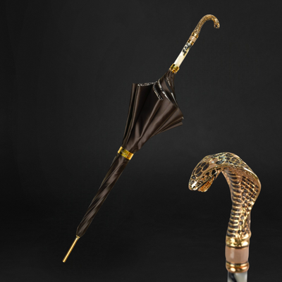 Exclusive snake charmer umbrella with gold cobra handle