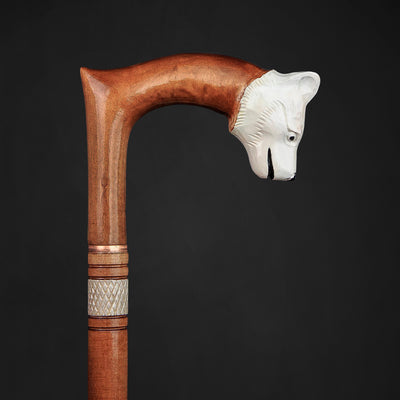 Handcrafted wooden stick with artistic dog design